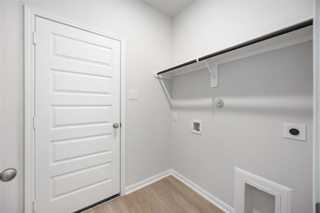 laundry room with hookup for a gas dryer, electric dryer hookup, hookup for a washing machine, and hardwood / wood-style flooring