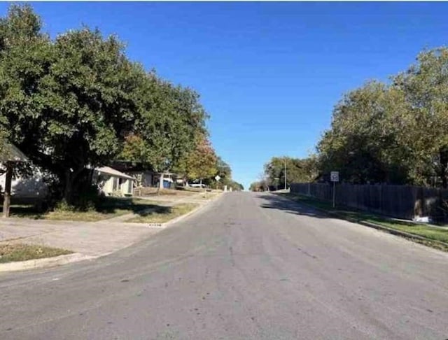 view of street with sidewalks and curbs