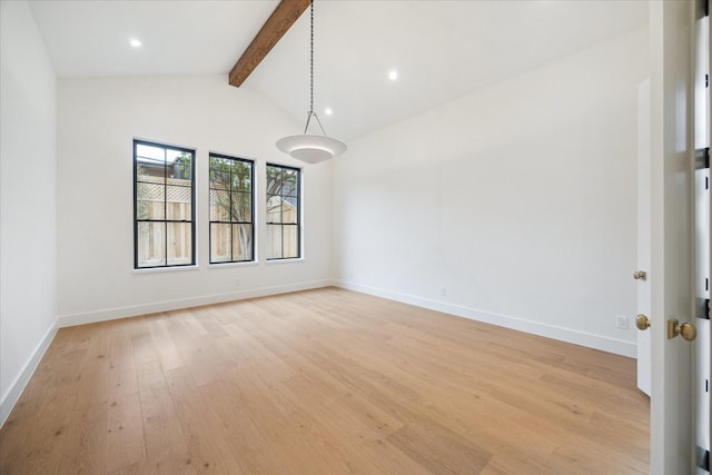 empty room featuring light hardwood / wood-style flooring, high vaulted ceiling, and beamed ceiling