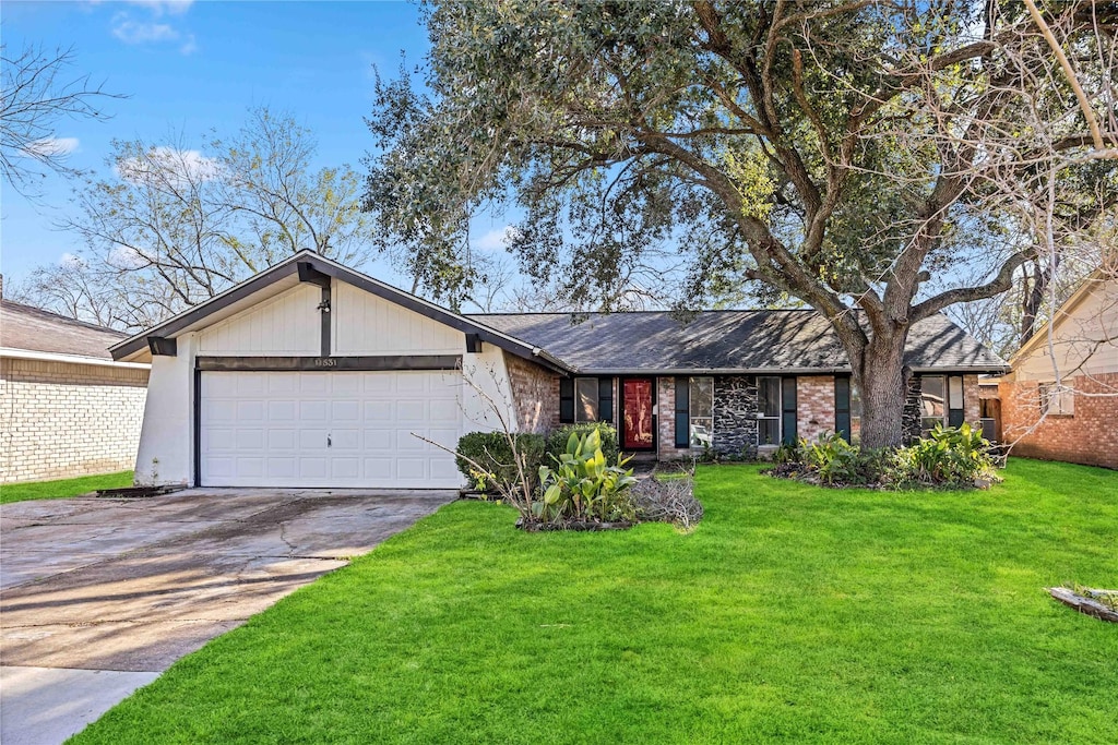 single story home featuring a front yard and a garage