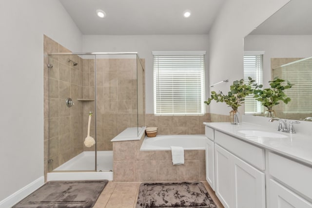 bathroom with tile patterned floors, separate shower and tub, and vanity