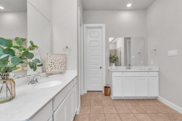 bathroom featuring tile patterned flooring and vanity