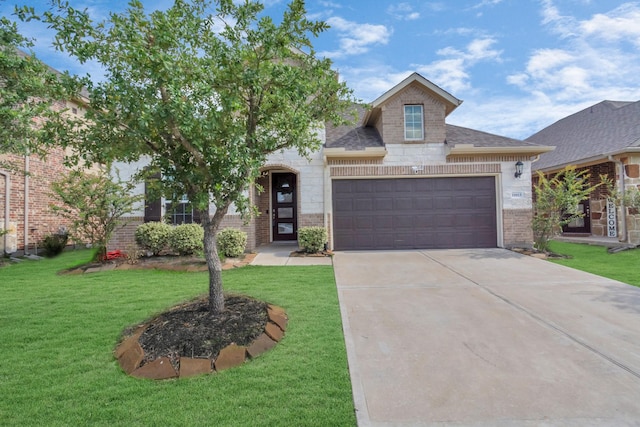 view of front facade with a garage and a front yard