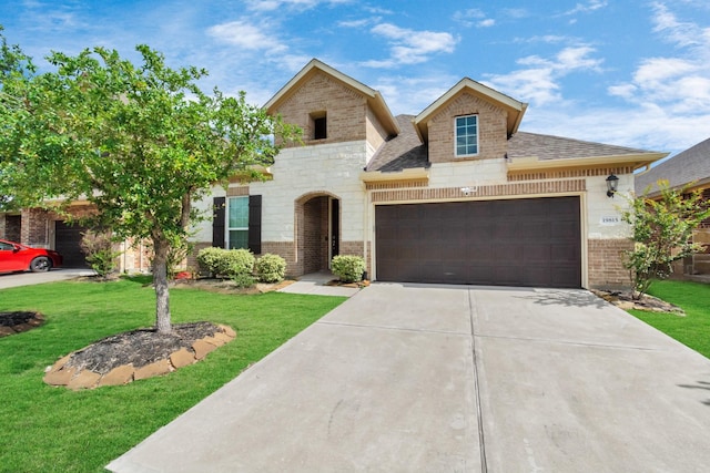 view of front of house with a front lawn and a garage