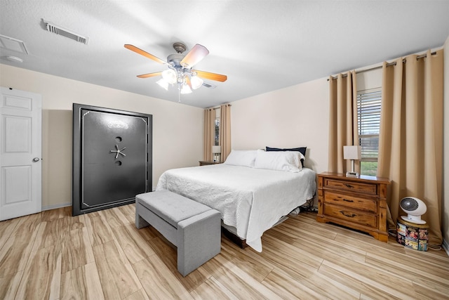 bedroom featuring light wood-type flooring and ceiling fan