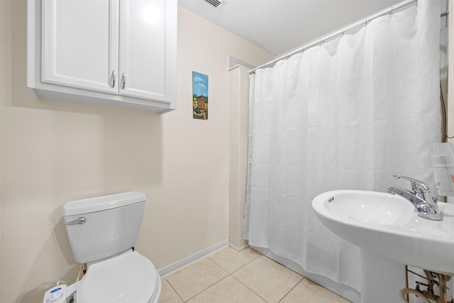 bathroom with toilet, a shower with shower curtain, tile patterned flooring, and sink