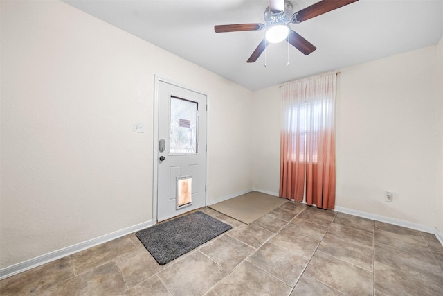 entrance foyer featuring ceiling fan