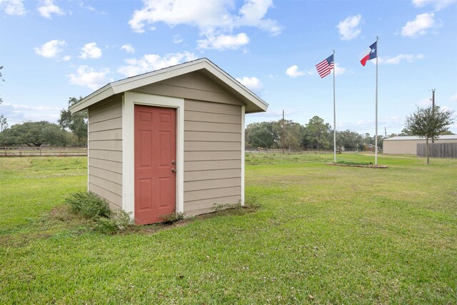 view of outbuilding featuring a lawn