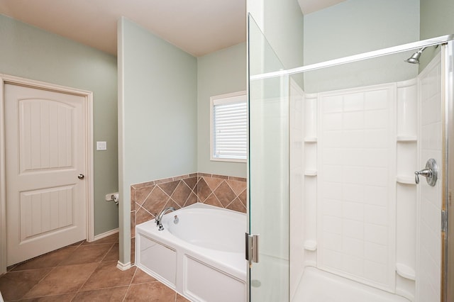 bathroom with independent shower and bath and tile patterned floors