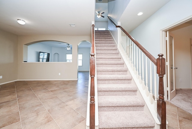 stairway with ceiling fan