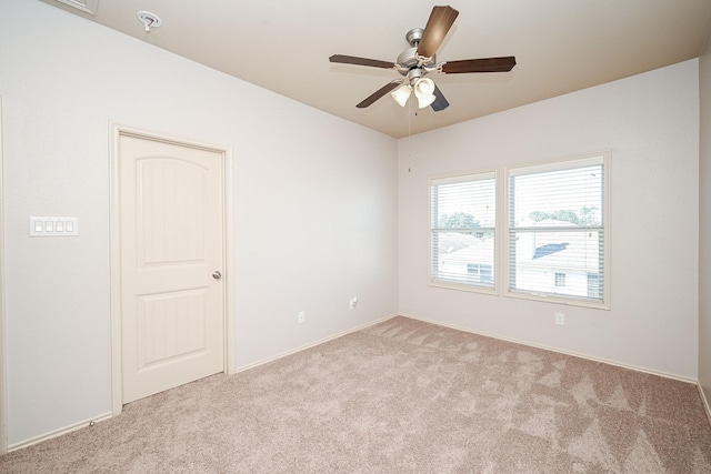 empty room with light carpet and ceiling fan