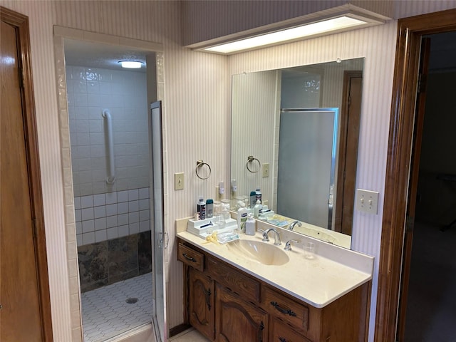 bathroom with vanity and walk in shower