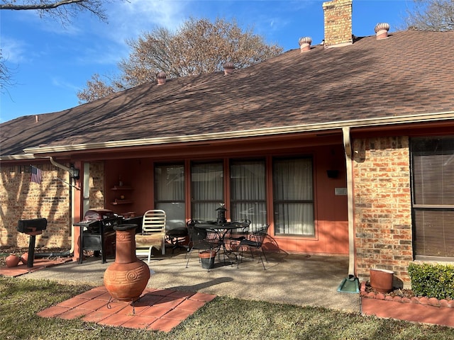 view of patio featuring a grill