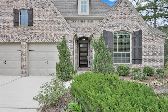 view of exterior entry featuring a garage