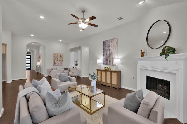 living room featuring dark hardwood / wood-style floors and ceiling fan