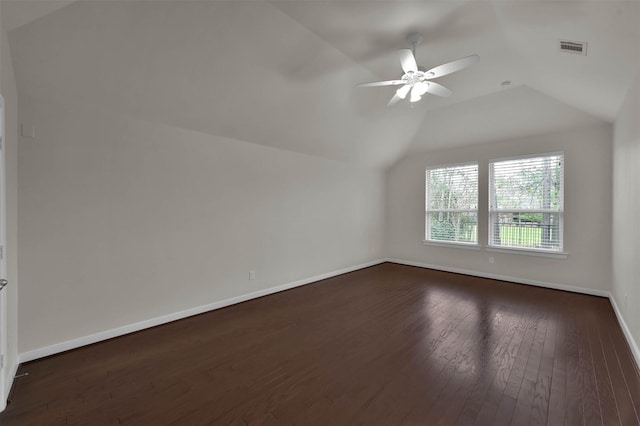 additional living space featuring lofted ceiling, dark hardwood / wood-style floors, and ceiling fan