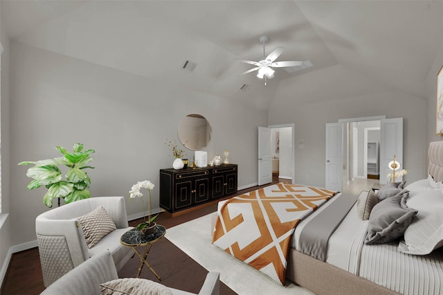 bedroom with dark wood-type flooring, ceiling fan, and lofted ceiling