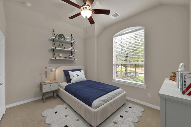 carpeted bedroom featuring ceiling fan, lofted ceiling, and multiple windows