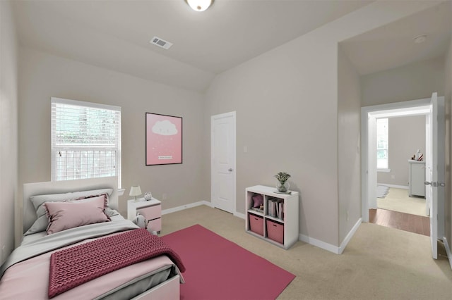 bedroom with light carpet