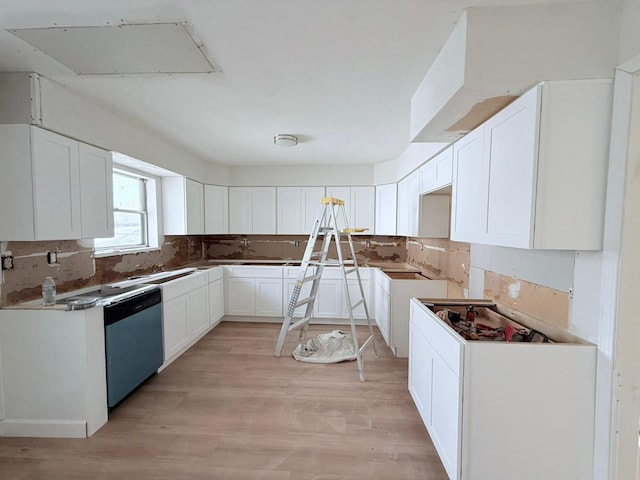 kitchen featuring decorative backsplash, stainless steel dishwasher, white cabinets, and light wood-type flooring