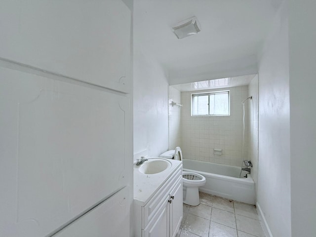 full bathroom with tile patterned floors, toilet, vanity, and tiled shower / bath combo