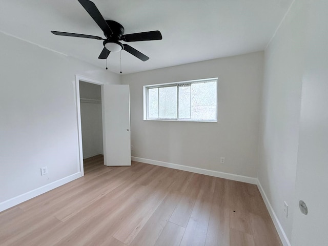 unfurnished bedroom with ceiling fan, a closet, and light hardwood / wood-style flooring