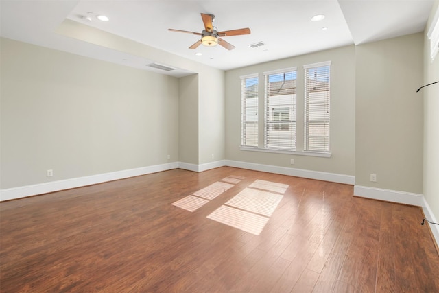 spare room with ceiling fan and wood-type flooring