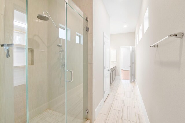 bathroom with an enclosed shower and vanity