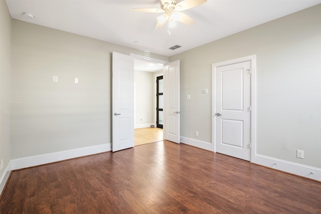 unfurnished bedroom with ceiling fan and hardwood / wood-style floors