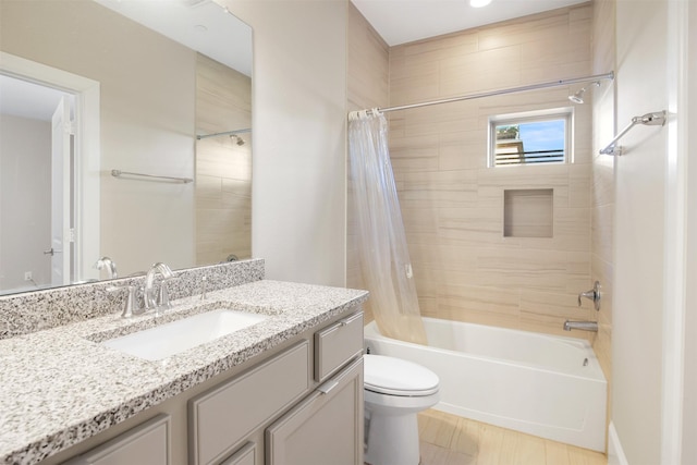 full bathroom featuring toilet, vanity, and shower / bath combo with shower curtain