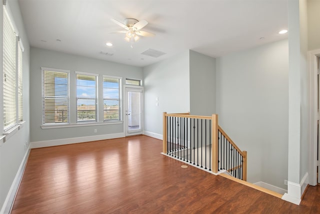 unfurnished room with ceiling fan and wood-type flooring