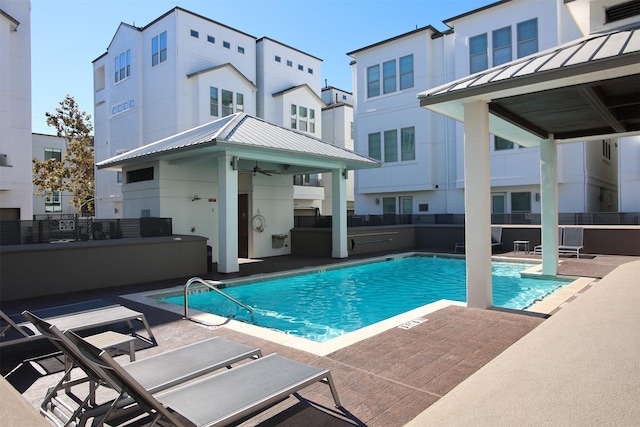 view of pool featuring a patio area, a gazebo, and ceiling fan