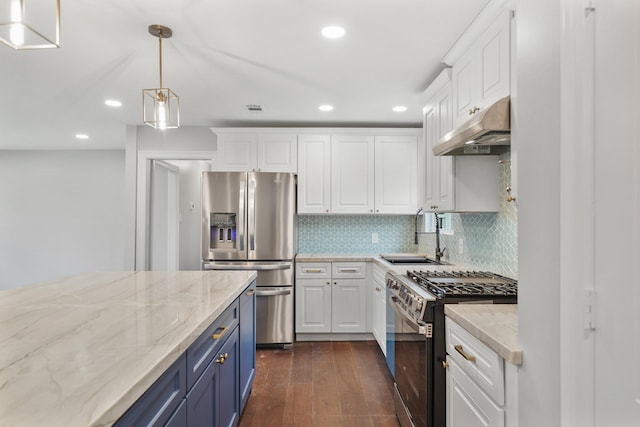 kitchen with white cabinetry, stainless steel appliances, blue cabinetry, hanging light fixtures, and sink