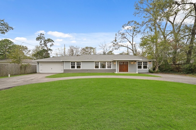 single story home featuring a garage and a front yard