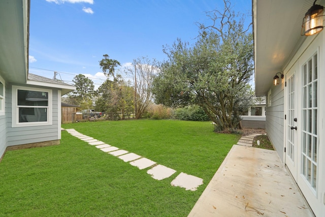 view of yard with french doors