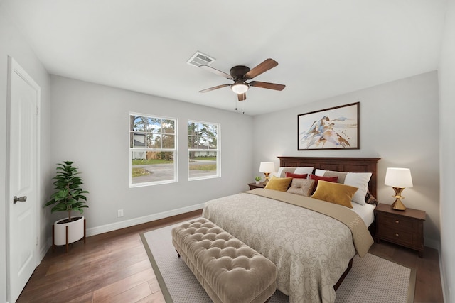 bedroom with dark wood-type flooring and ceiling fan