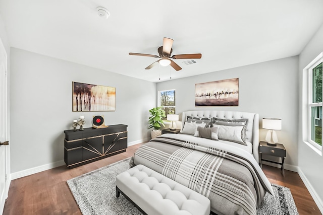 bedroom featuring ceiling fan and dark wood-type flooring