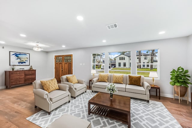 living room with light hardwood / wood-style floors