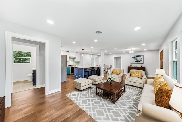 living room with light hardwood / wood-style flooring