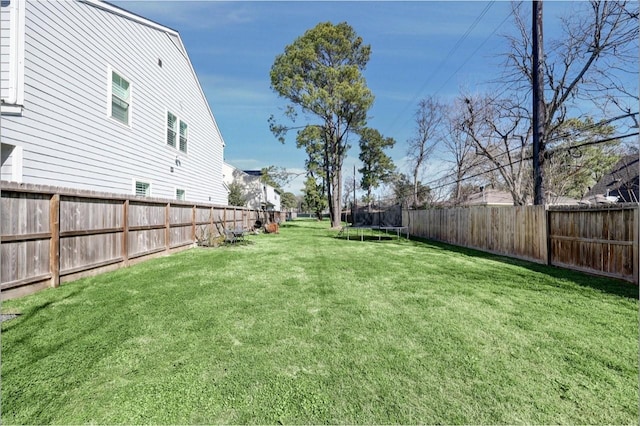 view of yard with a trampoline