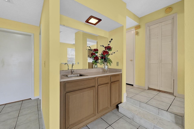 bathroom with tile patterned floors and vanity