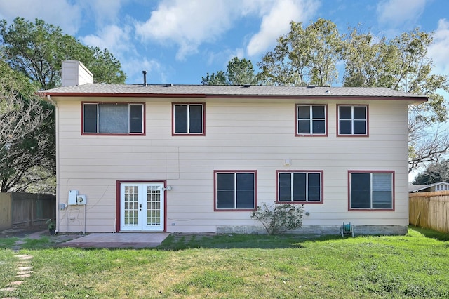 back of house featuring a patio area, a yard, and french doors