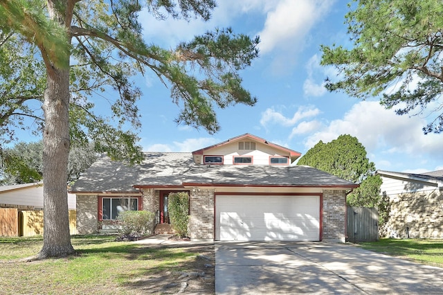 view of front of house featuring a garage and a front yard