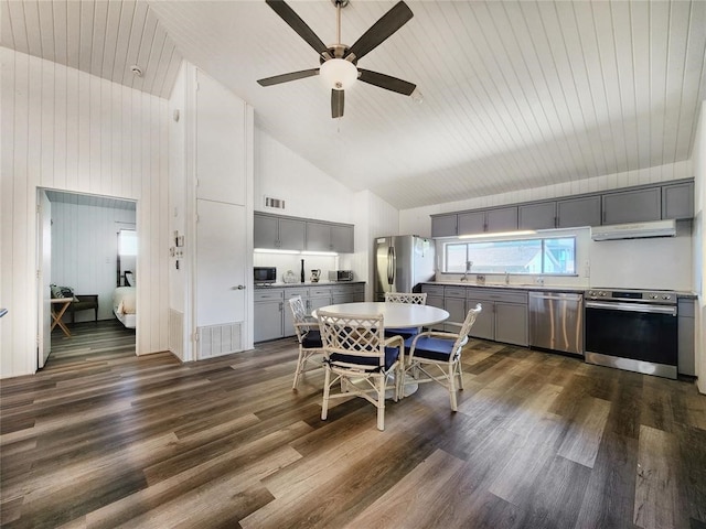 dining area featuring dark wood-type flooring, ceiling fan, and high vaulted ceiling