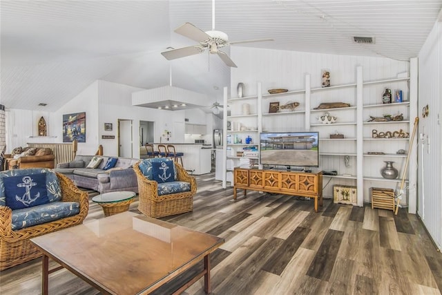 living room featuring lofted ceiling and hardwood / wood-style floors