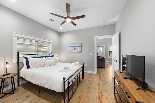 bedroom featuring ceiling fan and light hardwood / wood-style flooring