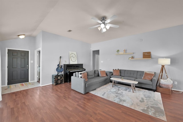 living room with hardwood / wood-style flooring and ceiling fan