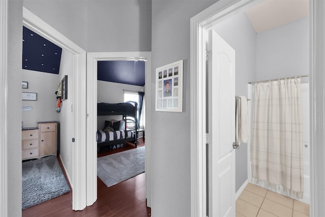 hallway featuring tile patterned flooring