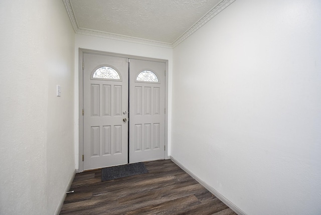 entryway with a textured ceiling, dark hardwood / wood-style floors, and ornamental molding