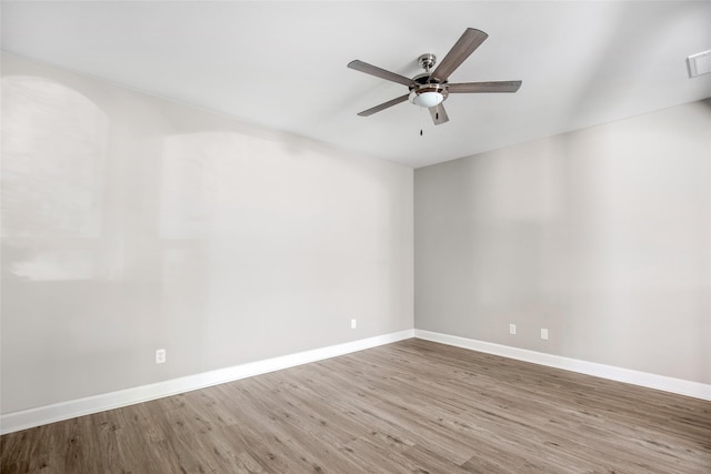 unfurnished room with ceiling fan and hardwood / wood-style floors